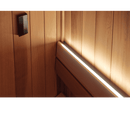 Western red cedar  panel with a light strip running along its edge in the corner of a sauna