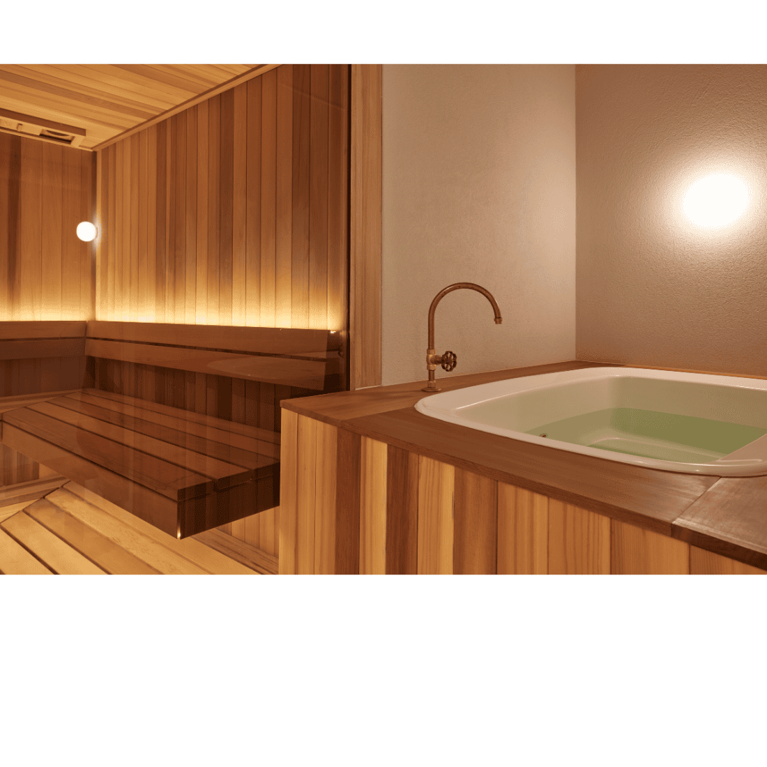 western red cedar  sauna with a hot tub inside a building