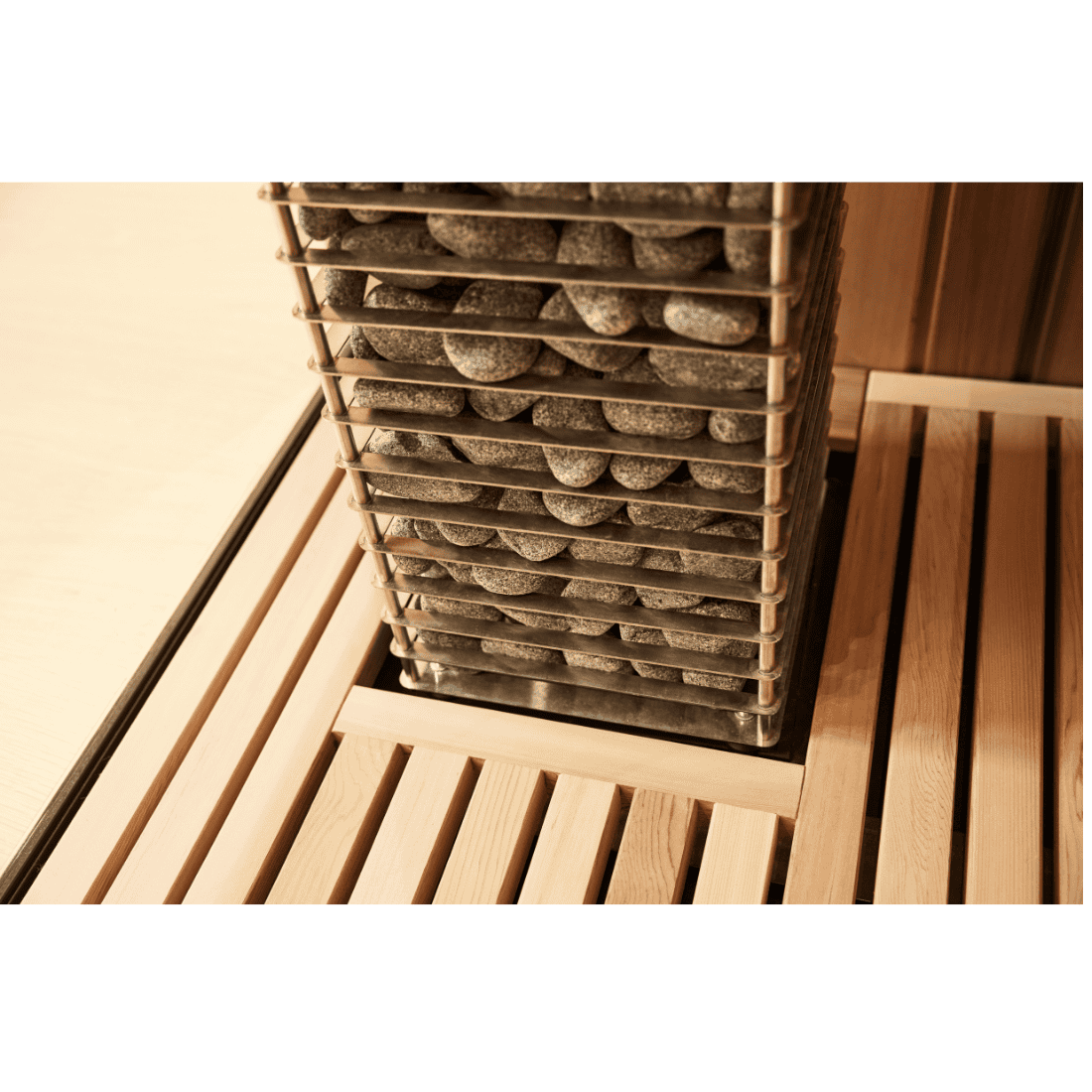 Close up of HUUM Cliff sauna heater embedded into wooden bench