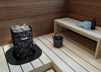 Helo Himalaya Elite sauna heater embedded in bench of light wood sauna 