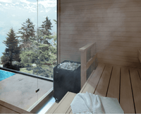 Helo Laava 9011 sauna heater in light wooden sauna with adjacent large window with a view of pine trees