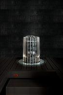 Helo Rocher Elite sauna heater embedded in dark coloured wood sauna bench with a stainless collar