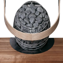 Huum drop sauna heater embedded in sauna bench showing safety rail and flange in situ