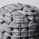 Close-up of top half of Huum Hive sauna heater showing rocks and the steel frame