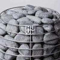 Close-up of top half of Huum Hive sauna heater showing rocks and the steel frame