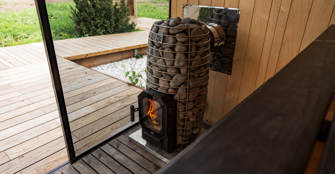 huum hive flow wood fired heater in outdoor sauna