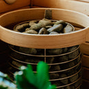 Close up of Huum Hive mini heater with pine coloured safety rail installed