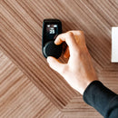 male handing adjusting setting on huum uku local black sauna control