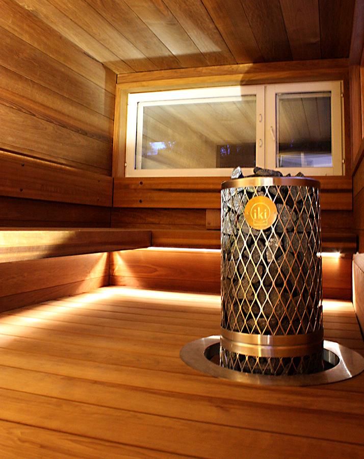 Iki Pillar sauna heater embedded in a sauna floor