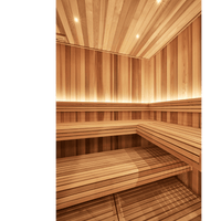 Well lit sauna interior with light coloured timber lining the walls and ceiling