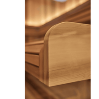 Close-up of side of a sauna bench with a smooth finish