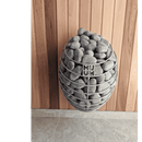 Western red cedar wall panelling with a HUUM drop sauna heater attached to the wall