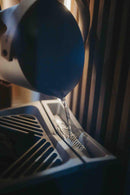 Water being poured onto top of Tylo Crown combi elite sauna heater