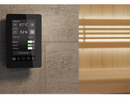 Tylo Elite control panel fixed to grey tiled wall outside of a sauna