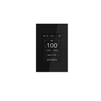 A modern black digital Tulikivi touchscreen control panel with a glossy screen displaying temperature settings, centered on a solid dark green background.