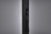 Black Tylo Steam Stella fixed to a tiled bathroom wall